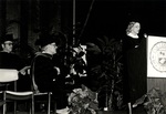 1981 College of Boca Raton Commencement: Marylou Whitney speaks at podium by Lynn University