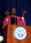 2000 Lynn Commencement: Speaker Alan Keyes at podium by Lynn University